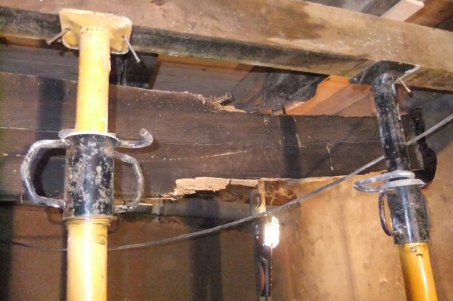 wooden beams embedded in walls the weight of the floors above proved too much for this wooden beam